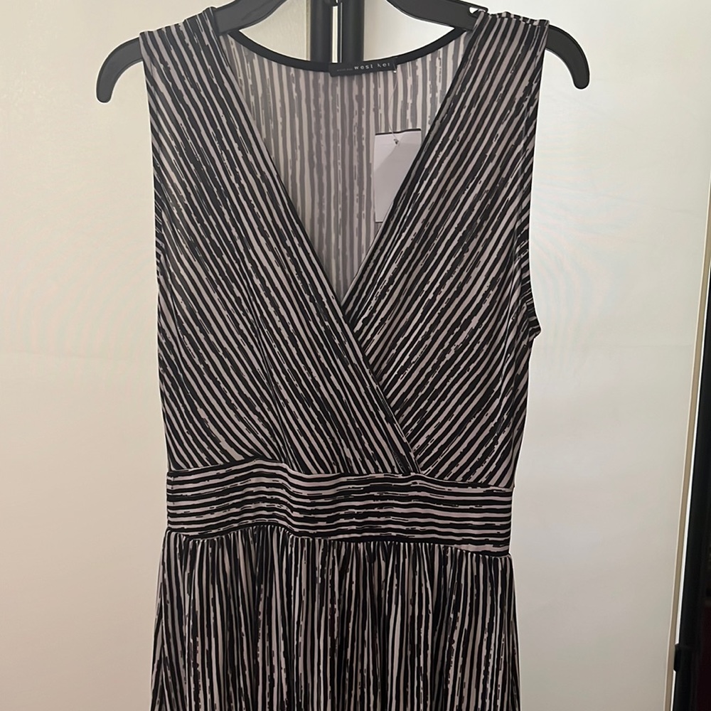 Long dress perfect for summer, fall. Brand new with tag.